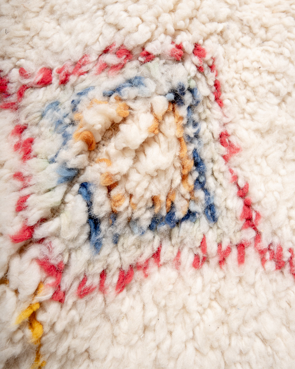 Modern, designer, handcrafted Berber rug from Morocco. Beniourain carpet with beautiful colours and patterns and fluffy wool texture.